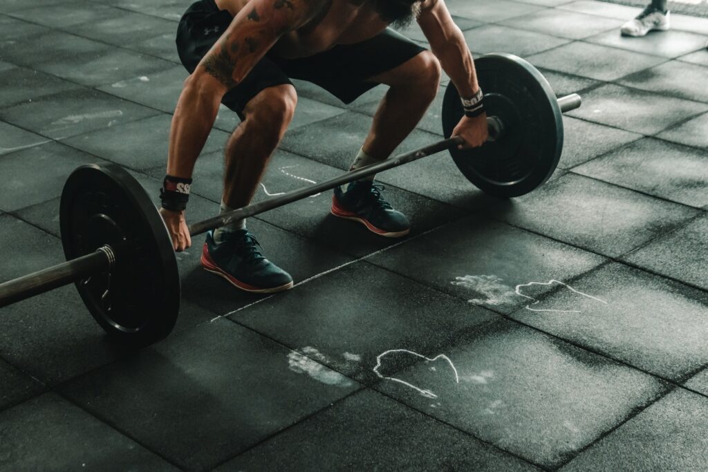 Image of a lifter wearing CrossFit shoes while performing an exercise - Are CrossFit shoes good for lifting?