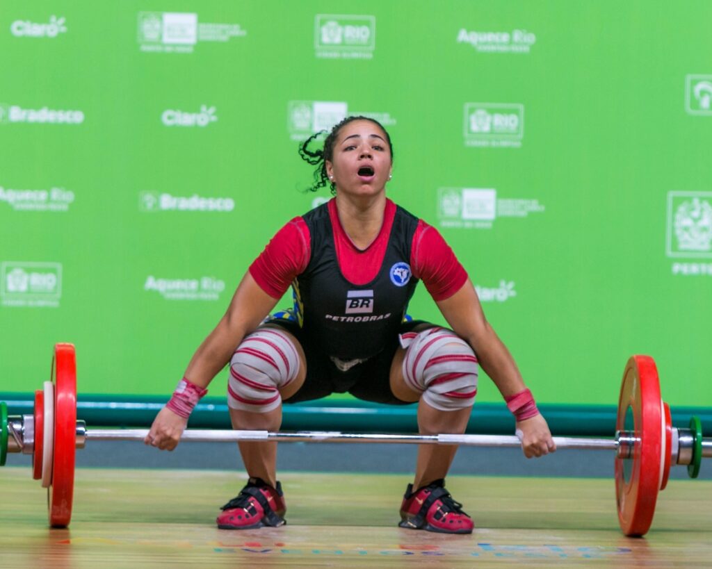 A weightlifter performing the snatch