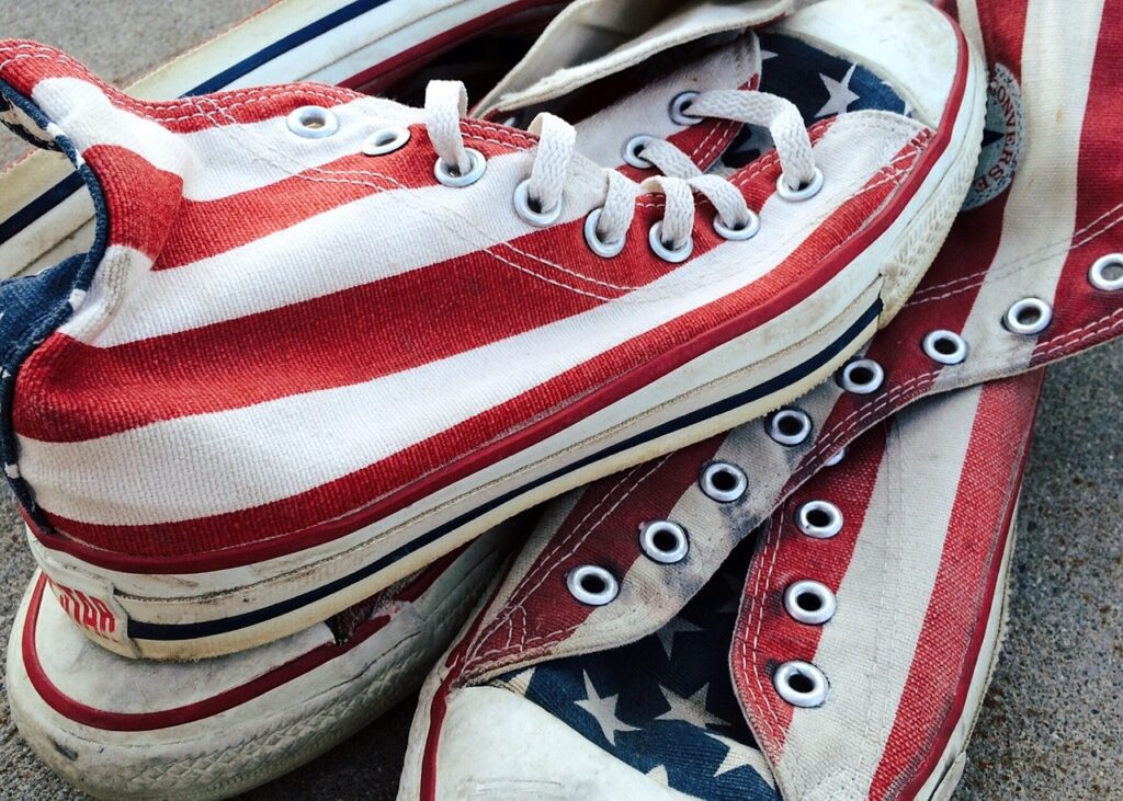 Converse shoes with an American flag design on them