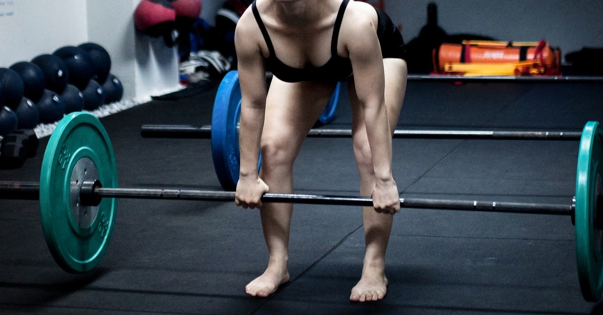 A lifter deadlifting without shoes
