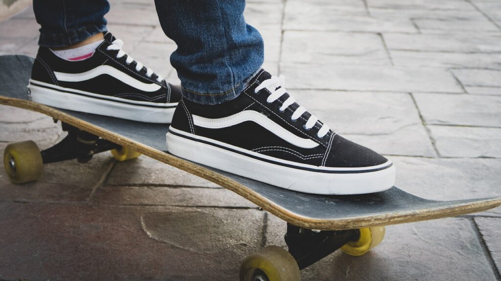 A person wearing Vans while standing on a skateboard - Are Vans good for lifting?